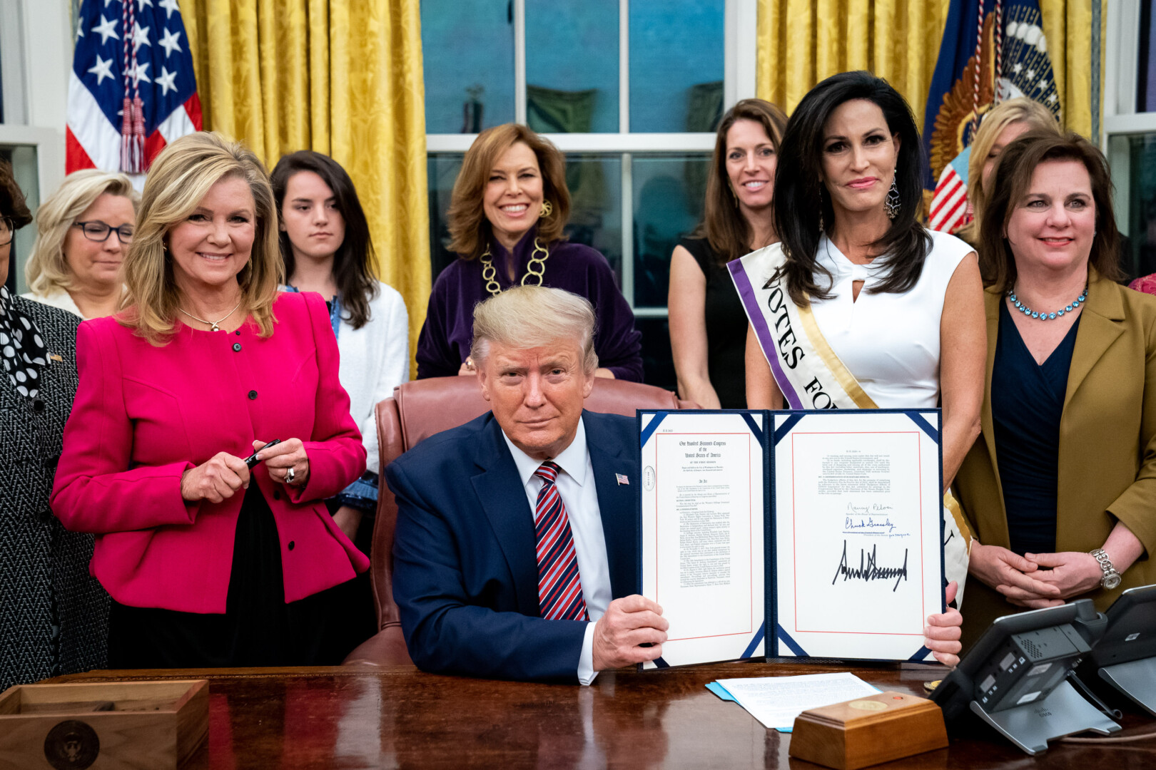 President Donald J. Trump signs H.R. 2423: The Women’s Suffrage Centennial Commemorative Coin Act by The White House is marked with Public Domain Mark 1.0.